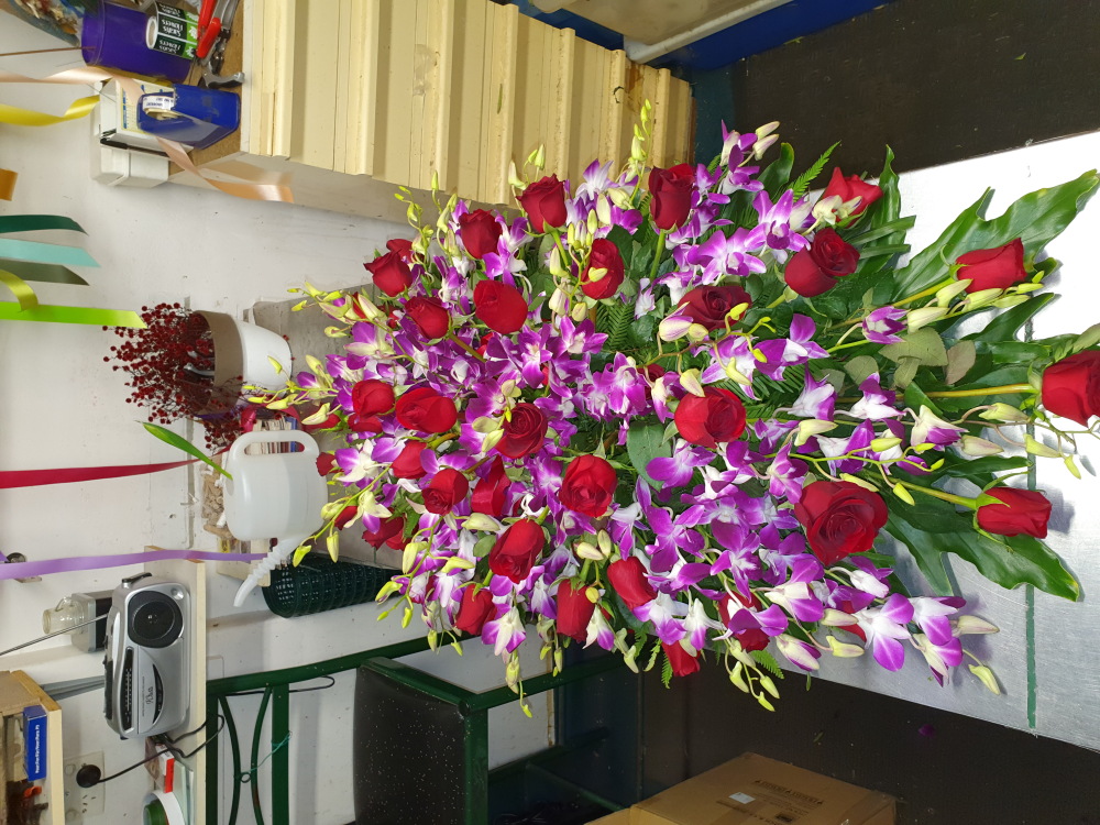 Casket Spray Purple Orchids with Red Roses